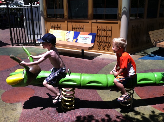 A photo of Ridge & Hiatt on a toy centipede